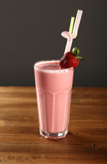 strawberry milkshake on a wooden background