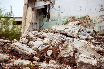 A closeup image of a garbage dump with ruined brick and wooden planks. Concept of disaster, war.
