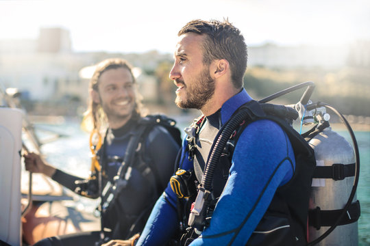 Scuba diver on a boat having fun