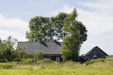 Obraz premium House in a field , abandoned building