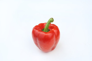 Red bell pepper isolated on white background.