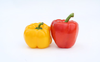 Yellow and red bell pepper isolated on white background.