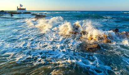 Dangerous waves crashing on rocks on shore of Crete, Greece