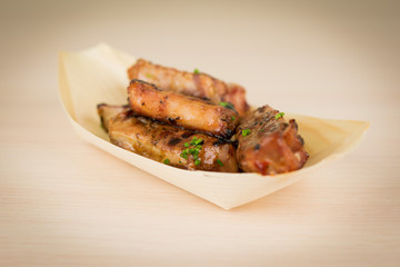 Spicy pork ribs on wooden table