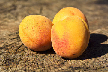 Fresh apricots on wooden table