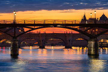 Fototapeta na wymiar Sunrise on the Pont des Art, Pont Neuf and the Seine River Banks. 1st Arrondissement, Paris, France
