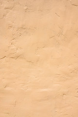 Detailed part of facade of the house, wall plastered and painted, textured background