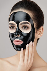 Beauty Skin Care Product. Portrait Woman With Black Peeling Mask