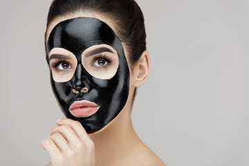 Beauty Face Care Peeling. Closeup Female With Black Peeling Mask On Skin