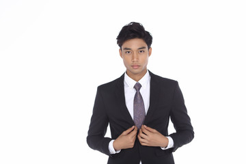 Asian Look Tan Skin Business Man in Black Suit Pant Shoe necktie, studio lighting white background isolated copy space, half body fashion pose show both hands