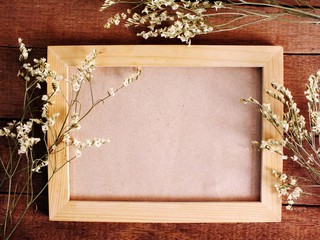space wooden frame with dired flower bouquet