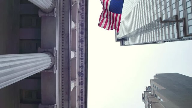 Symbols of the United States of America. State flag, the banking system. Financial district of New York City. Dolly shot .