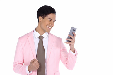 Pink Suit pants black shoe Businessman, deal sale growth contract successful and express feeling yes wow over smart mobile phone, studio lighting white background isolated