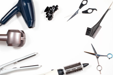 Various hair styling tools on white background