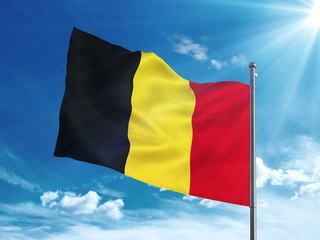 Belgium flag waving in the blue sky