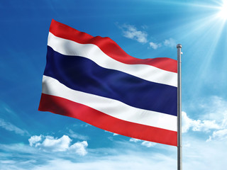 Fototapeta na wymiar Thailand flag waving in the blue sky