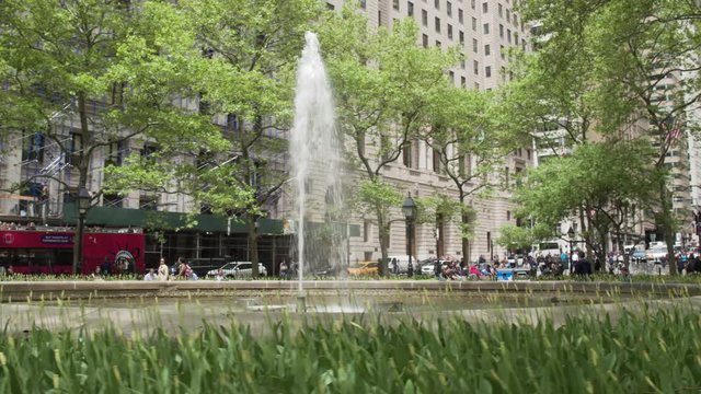 Parks and Fountains in lower Manhattan. Financial district wall street. Steadicam shot