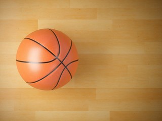 Obraz premium 3D rendering basketball ball on wooden floor