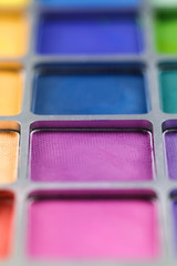 pallet of colored eye shadows, texture. Shallow depth of field