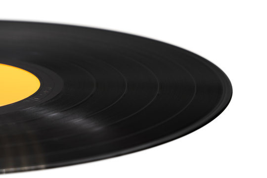 Segment of vinyl record with label on white background