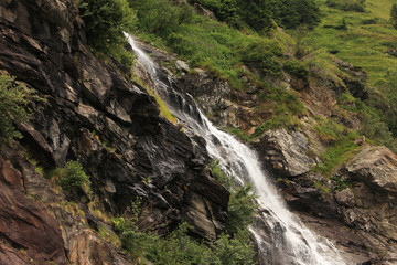 Fototapeta na wymiar Capra waterfall on Transfagarasan Road, in southern section of Carpathian Mountains in Romania.