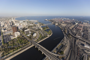 Aerial view of streets, buildings, port facilities and the end of the Los Angeles river in downtown Long Beach, California.   