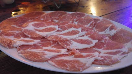 A pork slice on the dish.