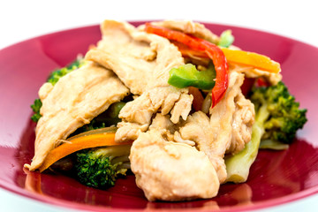 wok fried chicken stir fry with sweet peppers and chinese vegetables