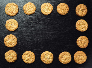 Biscuit sweet cookie background. Domestic stacked butter biscuit pattern concept,close up macro.Homemade cookies on wooden table.Cereal biscuits with the sesame,peanuts,sunflower and amaranth.