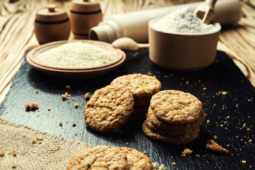 Biscuit sweet cookie background. Domestic stacked butter biscuit pattern concept,close up macro.Homemade cookies on wooden table.Cereal biscuits with the sesame,peanuts,sunflower and amaranth.