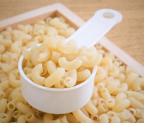 Elbow Macaroni or Gomiti Pasta in Measuring Cup