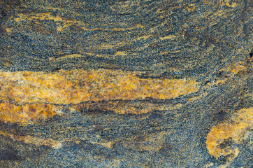 The texture of the stone.Granite,striped pattern.Close photographed.