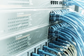 Network cables in switch and firewall in cloud computing data center server rack