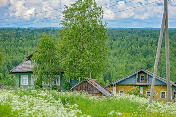 Abandoned old russian village with traditional wooden house. Vologda region, Russia