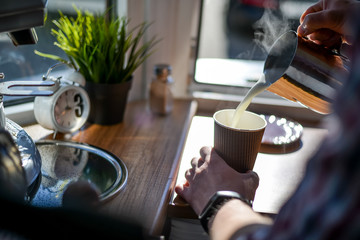 A glass of latte in the coffee house to go