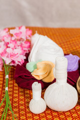 Spa and Massage Item on orange thai-style mat