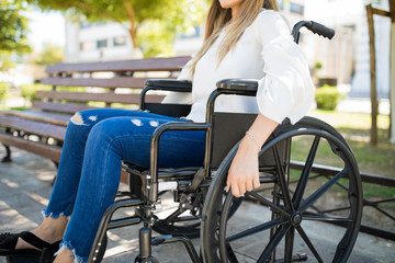 Obraz premium Disabled woman using a wheelchair