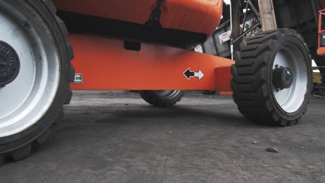Industrial cherry picker tyres tracking around 4K