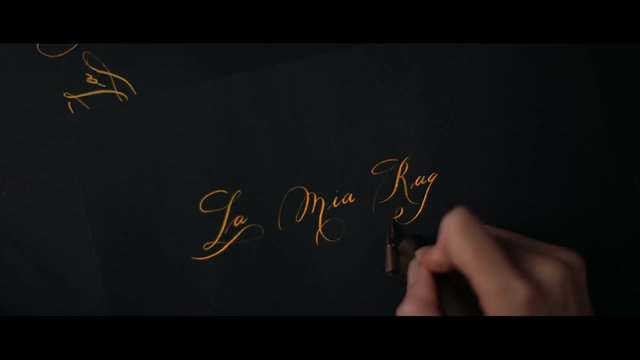 female hand writes a pen calligraphic signs