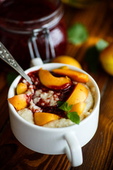 Oatmeal with jam and fresh apricots