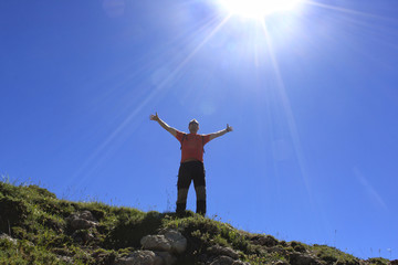 Fototapeta na wymiar Man feeling happiness in the high of a mountain