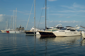 Fototapeta premium Row of luxury yachts mooring in a harbour.