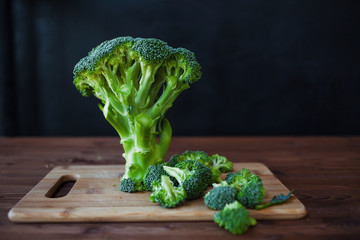 Fresh broccoli. Many green broccoli on a wooden table. Close-up