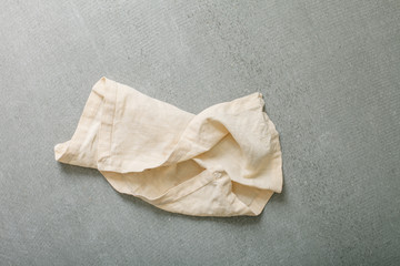 Served Table with White Crumpled Napkin Top View Minimal Picture on Grey Vintage Background