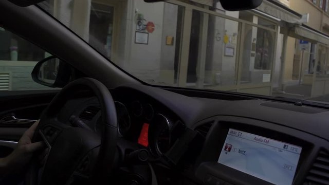Man's hands firmly holding steering wheel, driving car to necessary address