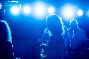 Drunk girl staggering in discotheque