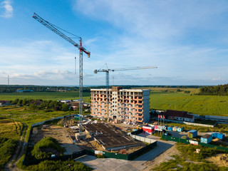 Aerial view of multi-storey building construction at summer time