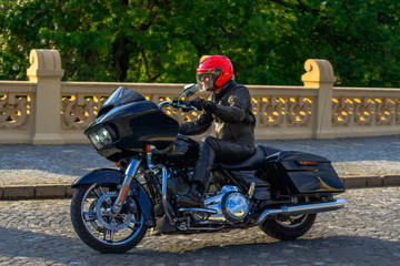 Fototapeta premium Rider on black custom motorbike 