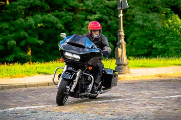 Rider on black custom motorbike 