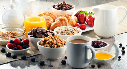 Breakfast served with coffee, juice, croissants and fruits